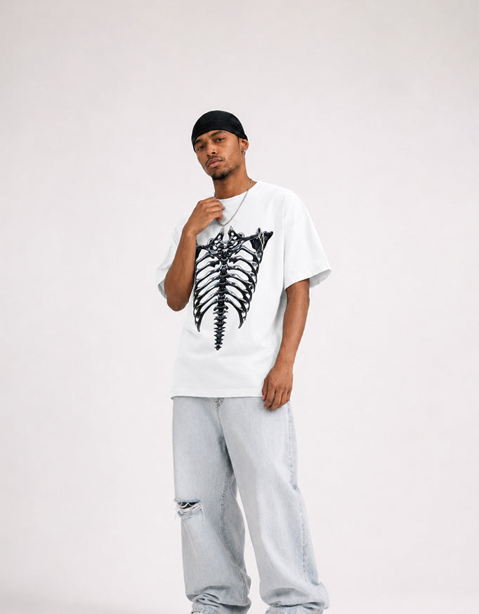 Male model wearing GUILTY PARTY white oversized ribcage graphic t-shirt