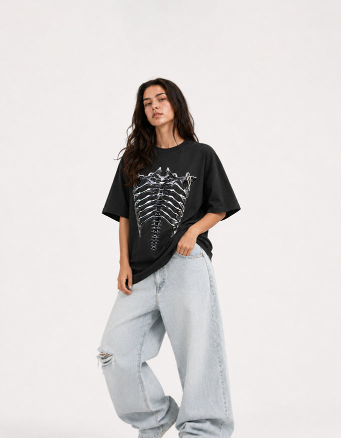 Female model wearing GUILTY PARTY white oversized ribcage graphic t-shirt