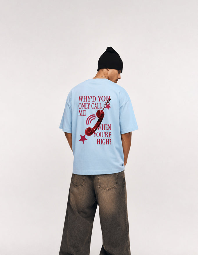 Back view of GUILTY PARTY baby blue oversized tee with red phone graphic and statement typography
why'd you only call me when you're high?