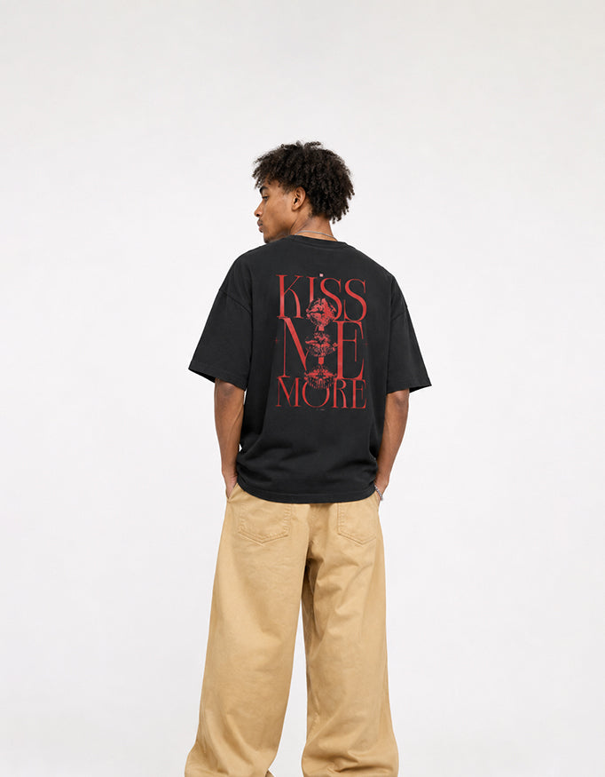 Back view of GUILTY PARTY white oversized tee with bold red Kiss Me More graphic print